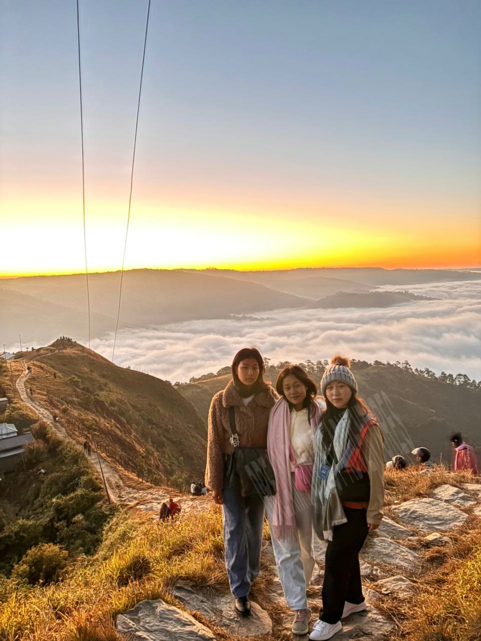 College excursion travelers at sunrise in Meghalaya